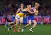 MELBOURNE, AUSTRALIA - AUGUST 17: Sam Davidson of the Bulldogs is tackled during the round 23 AFL match between Western Bulldogs and West Coast Eagles at Marvel Stadium on August 17, 2025 in Melbourne, Australia. (Photo by Graham Denholm/Getty Images)
