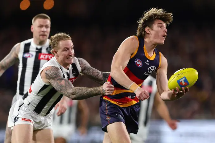 ADELAIDE, AUSTRALIA - SEPTEMBER 04: Josh Worrell of the Crows and Beau McCreery of the Magpies during the AFL First Qualifying Final match between the Adelaide Crows and the Collingwood Magpies at Adelaide Oval on September 04, 2025 in Adelaide, Australia. (Photo by Sarah Reed/AFL Photos via Getty Images)