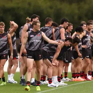 MELBOURNE, AUSTRALIA - NOVEMBER 10: Mason Redman directs training during the Essendon Bombers Pre-Season Training Media Opportunity at NEC Hangar on November 10, 2025 in Melbourne, Australia. (Photo by James Wiltshire/AFL Photos via Getty Images)