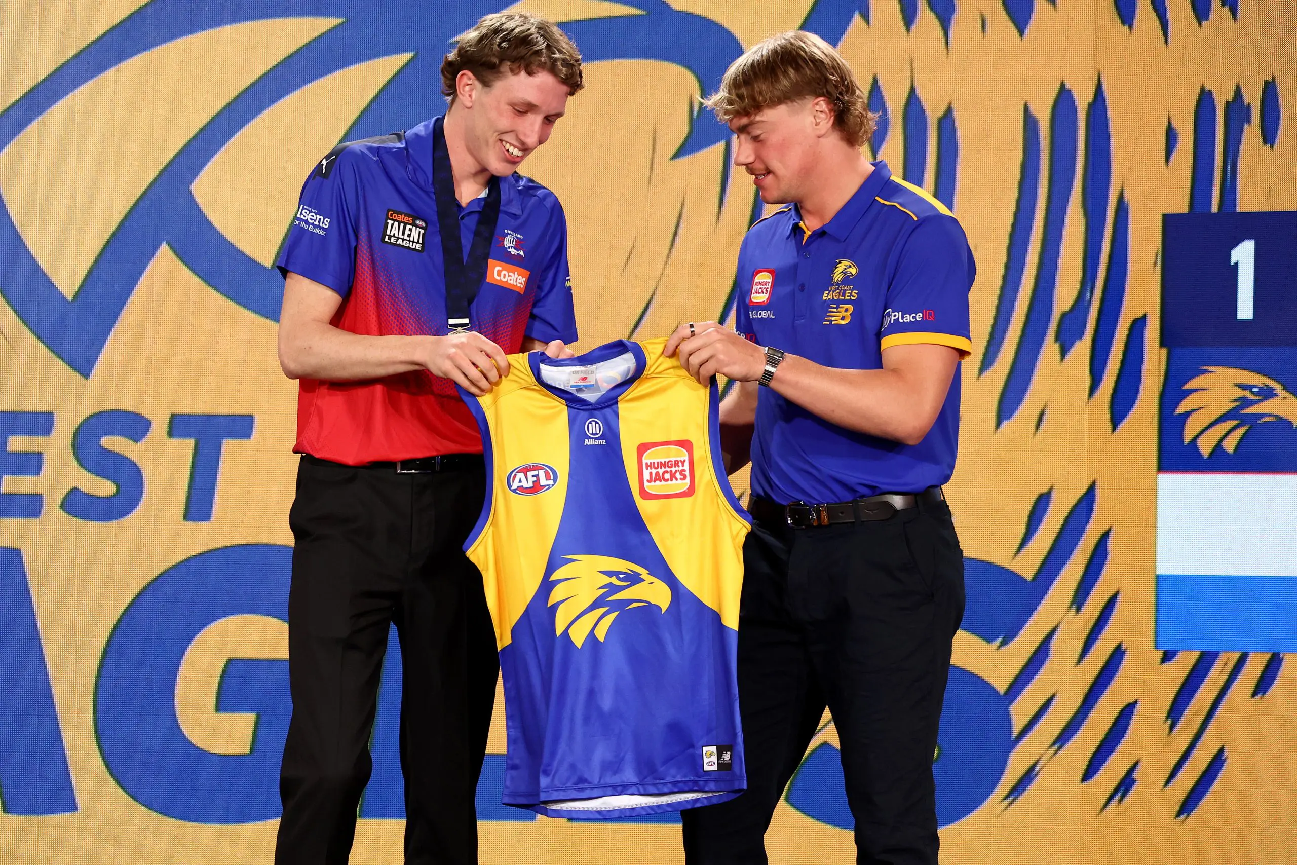 MELBOURNE, AUSTRALIA - NOVEMBER 19: Willem Duursma (Gippsland Power) is presented his jumper by Harley Reid of the Eagles after being drafted with pick one by the West Coast Eagles during the 2025 Telstra AFL Draft at Marvel Stadium on November 19th, 2025 in Melbourne, Australia. (Photo by James Wiltshire/AFL Photos via Getty Images)