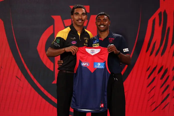 MELBOURNE, AUSTRALIA - NOVEMBER 19: Latrelle Pickett (Glenelg) poses with Kysaiah Pickett of the Demons after being drafted with pick 12 by the Melbourne Demons during the 2025 Telstra AFL Draft at Marvel Stadium on November 19th, 2025 in Melbourne, Australia. (Photo by James Wiltshire/AFL Photos via Getty Images)