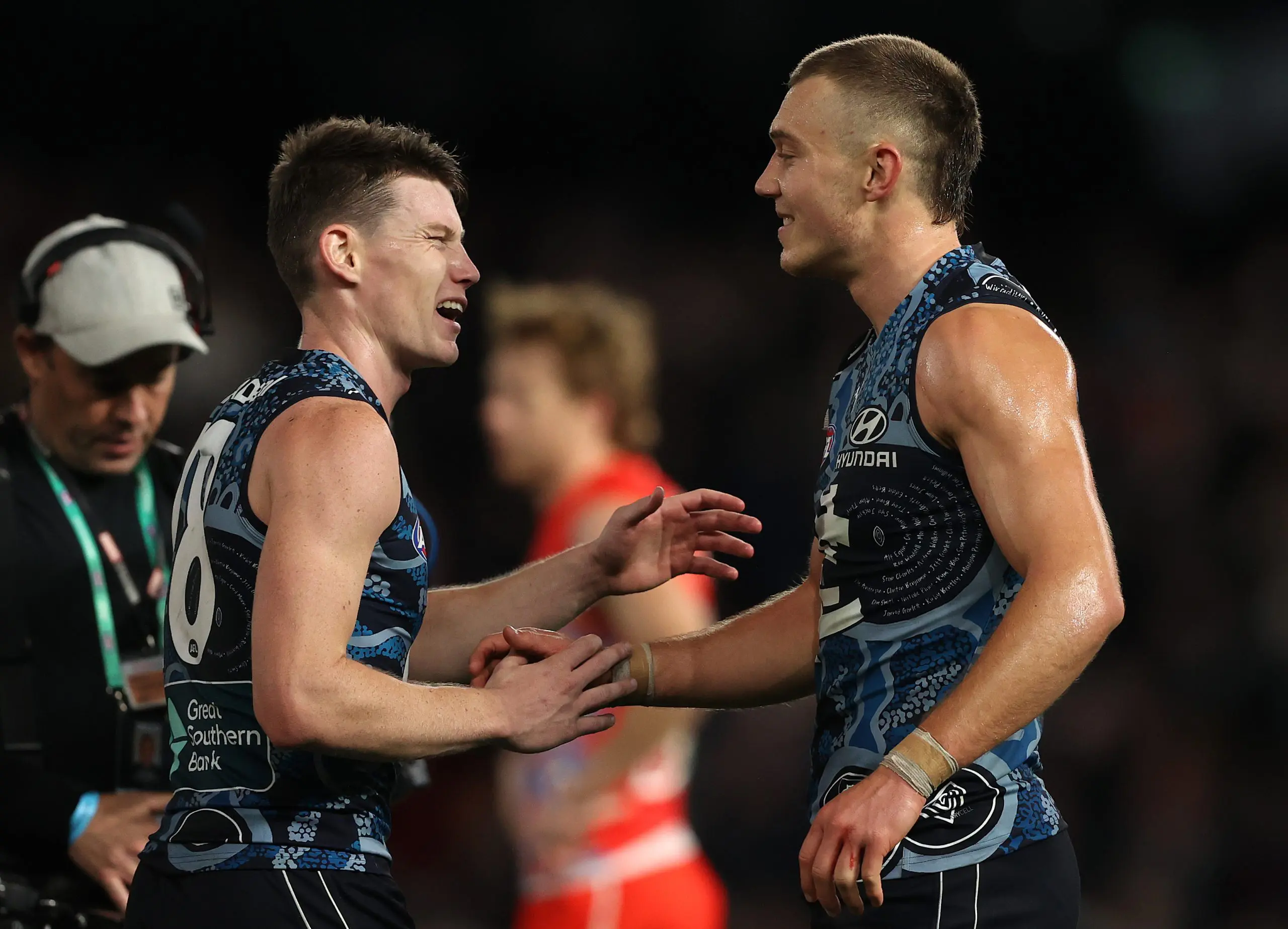 MELBOURNE, AUSTRALIA - MAY 20: Patrick Cripps of the Blues celebrates with Sam Walsh of the Blues after the Blues defeated the Swans during the round 10 AFL match between the Carlton Blues and the Sydney Swans at Marvel Stadium on May 20, 2022 in Melbourne, Australia. (Photo by Robert Cianflone/Getty Images)