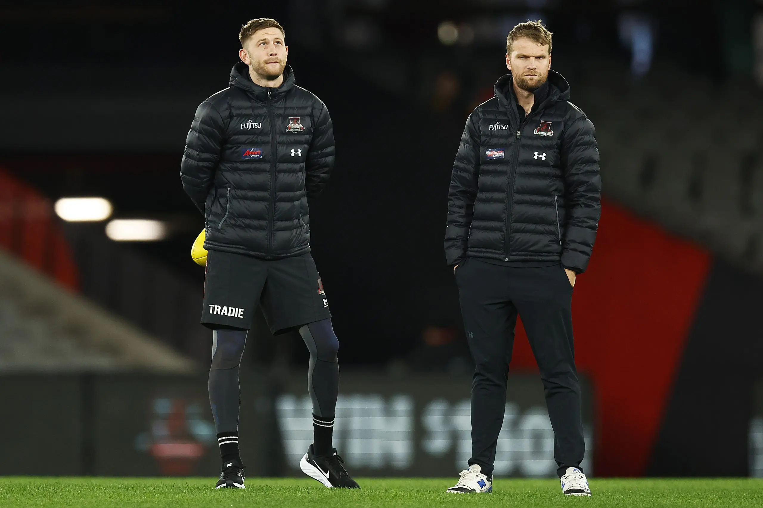 MELBOURNE, AUSTRALIA - JULY 17: Jayden Laverde of the Bombers and Jake Stringer of the Bombers chat before the round 18 AFL match between the Essendon Bombers and the Gold Coast Suns at Marvel Stadium on July 17, 2022 in Melbourne, Australia. (Photo by Daniel Pockett/Getty Images)