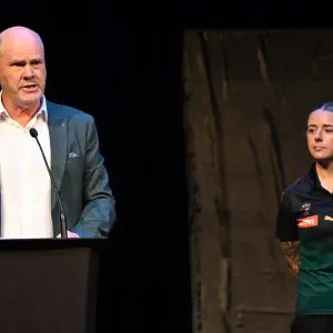 VARIOUS CITIES, AUSTRALIA - MARCH 18: Rodney Eade and Jessica Wuetschner prepare to unveil the new team colours during a media opportunity announcing the details for the Tasmanian AFL team, at Hobart Theatre Royal on March 18, 2024 in Various Cities, Australia. (Photo by Steve Bell/Getty Images)