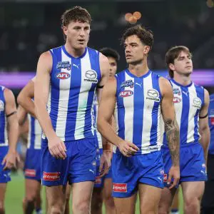 MELBOURNE, AUSTRALIA - APRIL 18: Nick Larkey of the Kangaroos and Jy Simpkin of the Kangaroos leave the field after the round six AFL match between North Melbourne Kangaroos and Carlton Blues at Marvel Stadium, on April 18, 2025, in Melbourne, Australia. (Photo by Daniel Pockett/Getty Images)