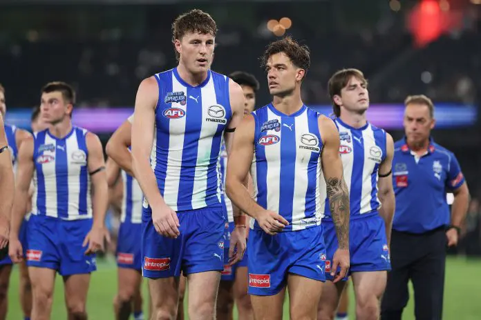 MELBOURNE, AUSTRALIA - APRIL 18: Nick Larkey of the Kangaroos and Jy Simpkin of the Kangaroos leave the field after the round six AFL match between North Melbourne Kangaroos and Carlton Blues at Marvel Stadium, on April 18, 2025, in Melbourne, Australia. (Photo by Daniel Pockett/Getty Images)