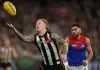 MELBOURNE, AUSTRALIA - AUGUST 22: Beau McCreery of the Magpies gathers the ball during the round 24 AFL match between Collingwood Magpies and Melbourne Demons at Melbourne Cricket Ground on August 22, 2025 in Melbourne, Australia. (Photo by Robert Cianflone/Getty Images)