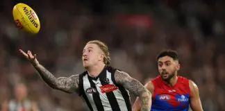 MELBOURNE, AUSTRALIA - AUGUST 22: Beau McCreery of the Magpies gathers the ball during the round 24 AFL match between Collingwood Magpies and Melbourne Demons at Melbourne Cricket Ground on August 22, 2025 in Melbourne, Australia. (Photo by Robert Cianflone/Getty Images)