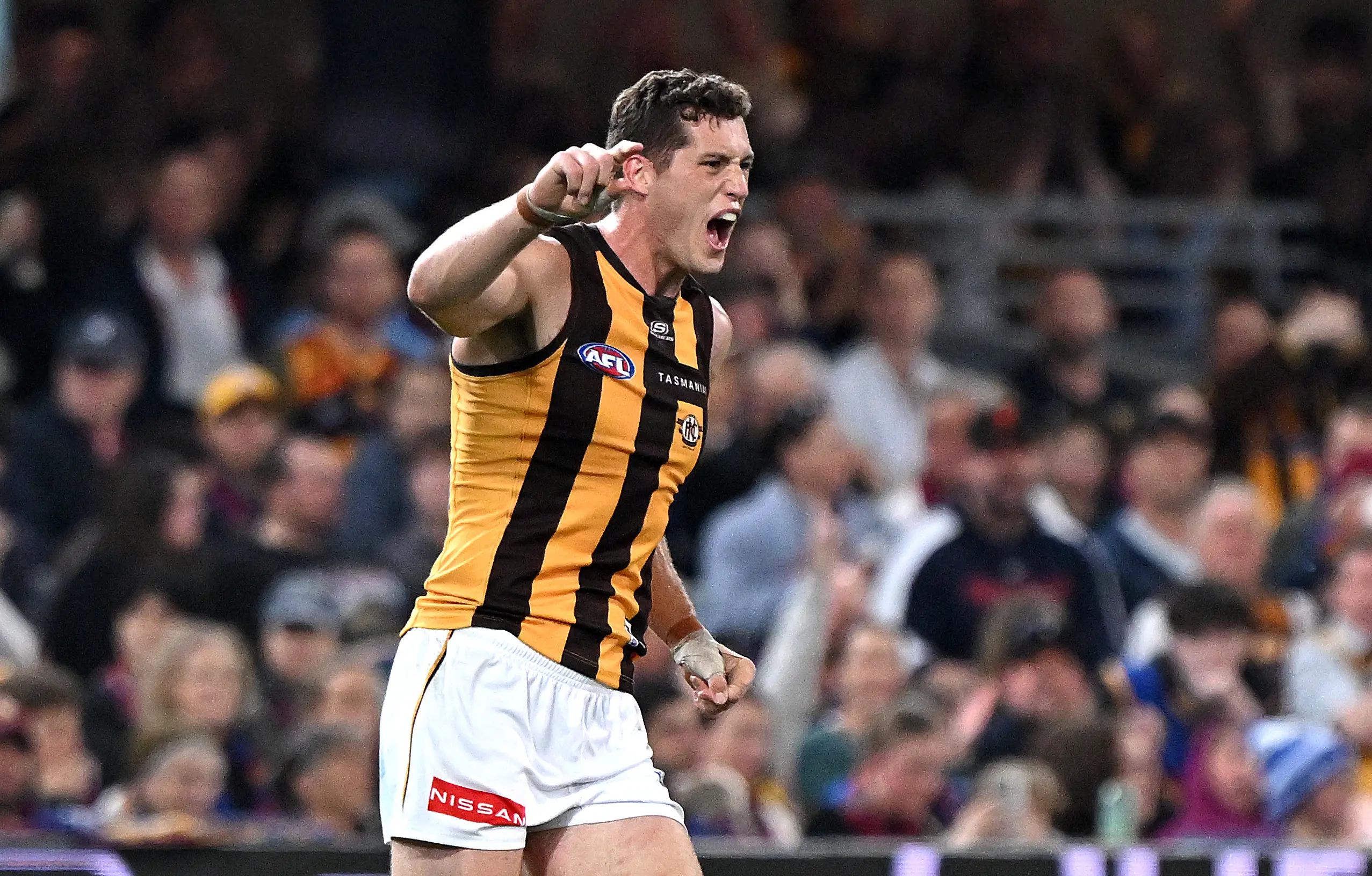 BRISBANE, AUSTRALIA - AUGUST 24: Lloyd Meek of the Hawks celebrates after kicking a goal during the round 24 AFL match between Brisbane Lions and Hawthorn Hawks at The Gabba on August 24, 2025 in Brisbane, Australia. (Photo by Bradley Kanaris/Getty Images)