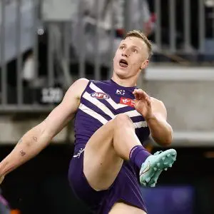 PERTH, AUSTRALIA - SEPTEMBER 06: Josh Treacy of the Dockers kicks the ball during the AFL Second Elimination Final match between the Fremantle Dockers and the Gold Coast Suns at Optus Stadium on September 06, 2025 in Perth, Australia. (Photo by Michael Willson/AFL Photos via Getty Images)