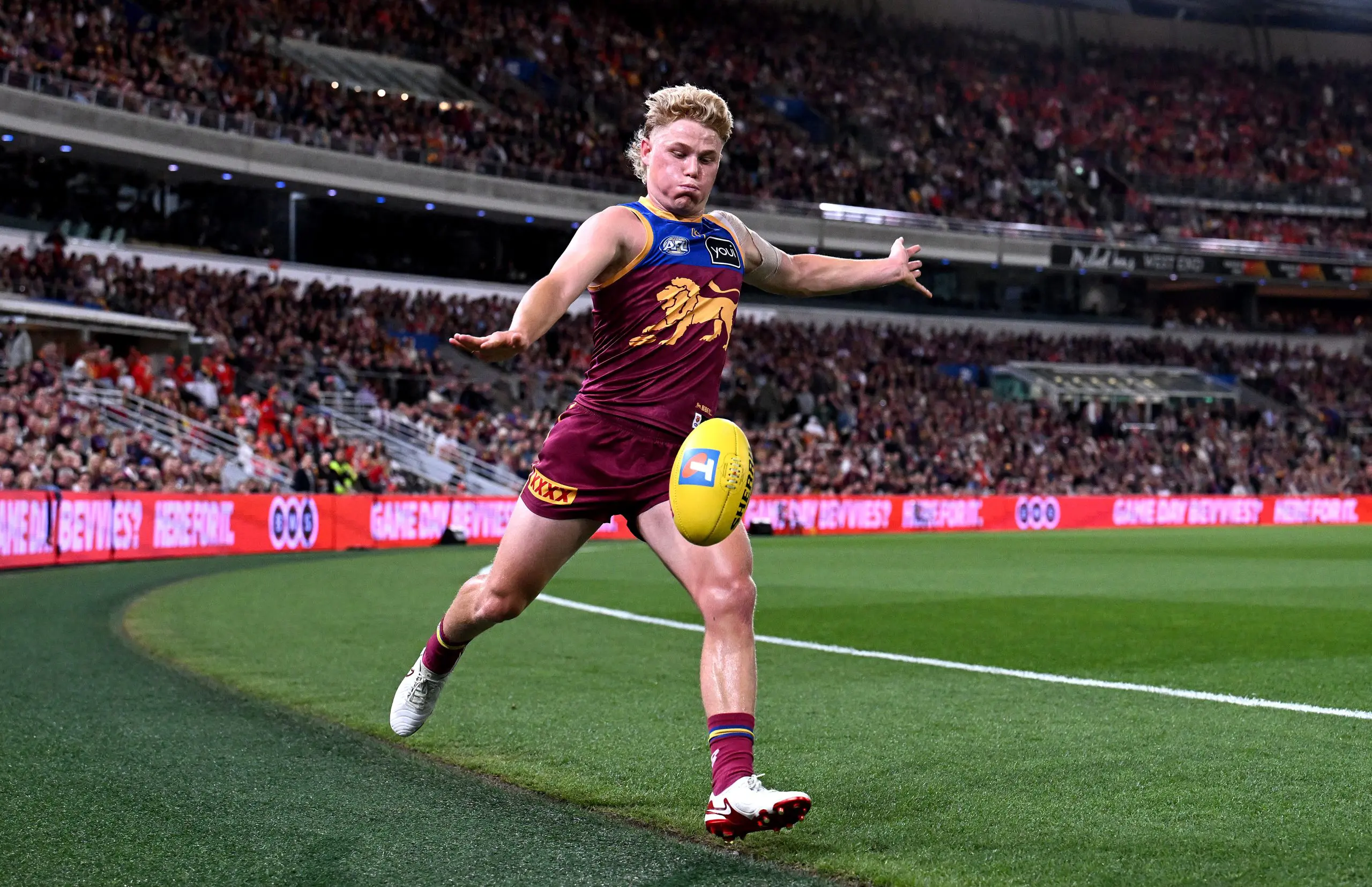 BRISBANE, AUSTRALIA - SEPTEMBER 13: Levi Ashcroft of the Lions kicks the ball during the AFL Semi Final match between Brisbane Lions and Gold Coast Suns at The Gabba on September 13, 2025 in Brisbane, Australia. (Photo by Bradley Kanaris/Getty Images)