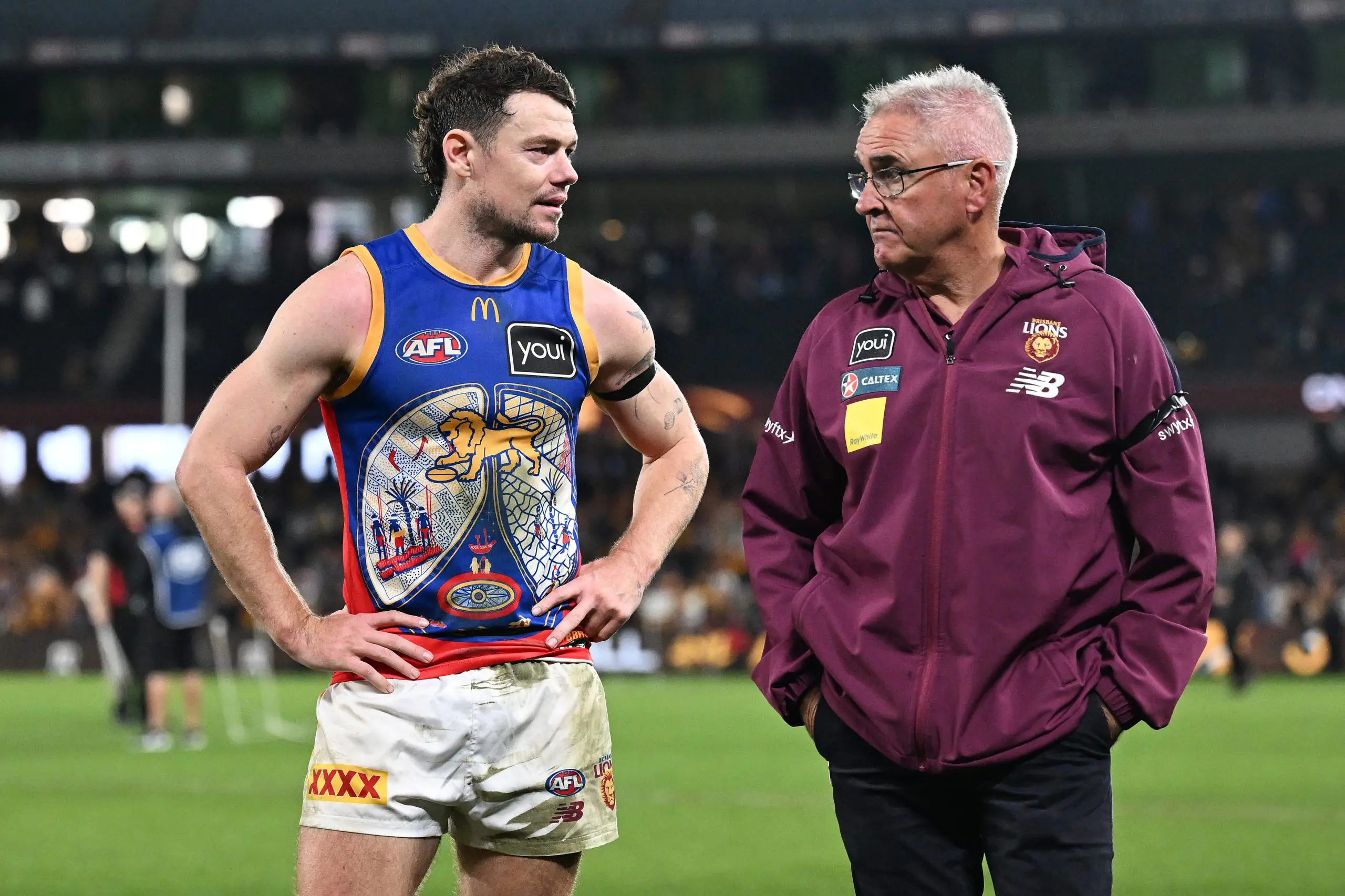 MELBOURNE, AUSTRALIA - MAY 26: Lachie Neale of the Lions and Chris Fagan, Senior Coach of the Lions look dejected after the round 11 AFL match between Hawthorn Hawks and Brisbane Lions at Marvel Stadium, on May 26, 2024, in Melbourne, Australia. (Photo by Daniel Pockett/Getty Images)