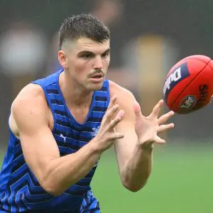 MELBOURNE, AUSTRALIA - NOVEMBER 25: Brayden George of the Kangaroos marks during a North Melbourne Kangaroos AFL training session at Arden Street Ground on November 25, 2024 in Melbourne, Australia. (Photo by Quinn Rooney/Getty Images)