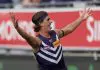GEELONG, AUSTRALIA - MARCH 15: Murphy Reid of the Dockers celebrates kicking a goal during the round one AFL match between Geelong Cats and Fremantle Dockers at GMHBA Stadium, on March 15, 2025, in Geelong, Australia. (Photo by Daniel Pockett/Getty Images)