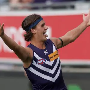 GEELONG, AUSTRALIA - MARCH 15: Murphy Reid of the Dockers celebrates kicking a goal during the round one AFL match between Geelong Cats and Fremantle Dockers at GMHBA Stadium, on March 15, 2025, in Geelong, Australia. (Photo by Daniel Pockett/Getty Images)