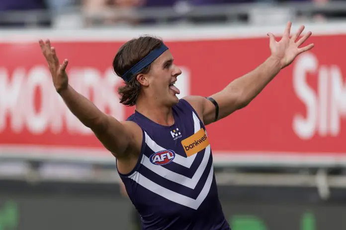 GEELONG, AUSTRALIA - MARCH 15: Murphy Reid of the Dockers celebrates kicking a goal during the round one AFL match between Geelong Cats and Fremantle Dockers at GMHBA Stadium, on March 15, 2025, in Geelong, Australia. (Photo by Daniel Pockett/Getty Images)