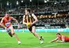 LAUNCESTON, AUSTRALIA - MARCH 29: Will Day of the Hawks runs the ball during the round 3 AFL match between the 
Hawthorn Hawks and GWS Giants at University of Tasmania Stadium, on March 29, 2025, in Launceston, Australia. (Photo by Steve Bell/Getty Images)