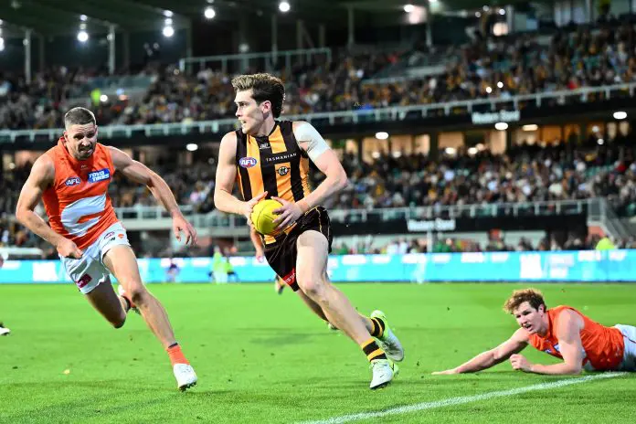 LAUNCESTON, AUSTRALIA - MARCH 29: Will Day of the Hawks runs the ball during the round 3 AFL match between the 
Hawthorn Hawks and GWS Giants at University of Tasmania Stadium, on March 29, 2025, in Launceston, Australia. (Photo by Steve Bell/Getty Images)