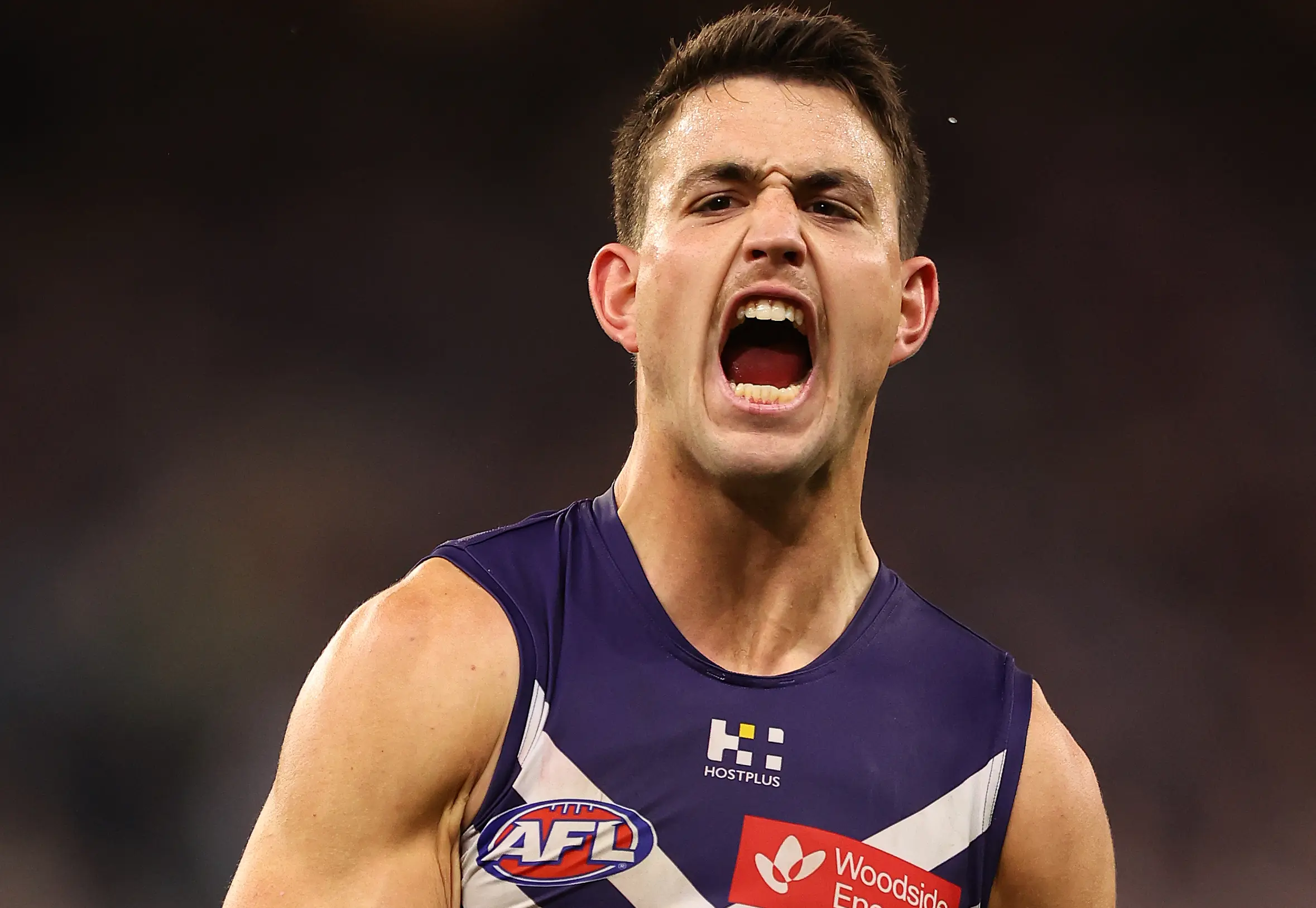 PERTH, AUSTRALIA - JULY 12: Patrick Voss of the Dockers celebrates a goal during the round 18 AFL match between the Fremantle Dockers and Hawthorn Hawks at Optus Stadium on July 12, 2025 in Perth, Australia. (Photo by Paul Kane/Getty Images)
