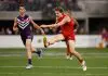 PERTH, AUSTRALIA - SEPTEMBER 06: Noah Anderson of the Suns kicks the ball during the AFL Second Elimination Final match between the Fremantle Dockers and the Gold Coast Suns at Optus Stadium on September 06, 2025 in Perth, Australia. (Photo by Michael Willson/AFL Photos via Getty Images)