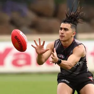 MELBOURNE, AUSTRALIA - NOVEMBER 10: Isaac Kako marks the ball during the Essendon Bombers Pre-Season Training Media Opportunity at NEC Hangar on November 10, 2025 in Melbourne, Australia. (Photo by James Wiltshire/AFL Photos via Getty Images)