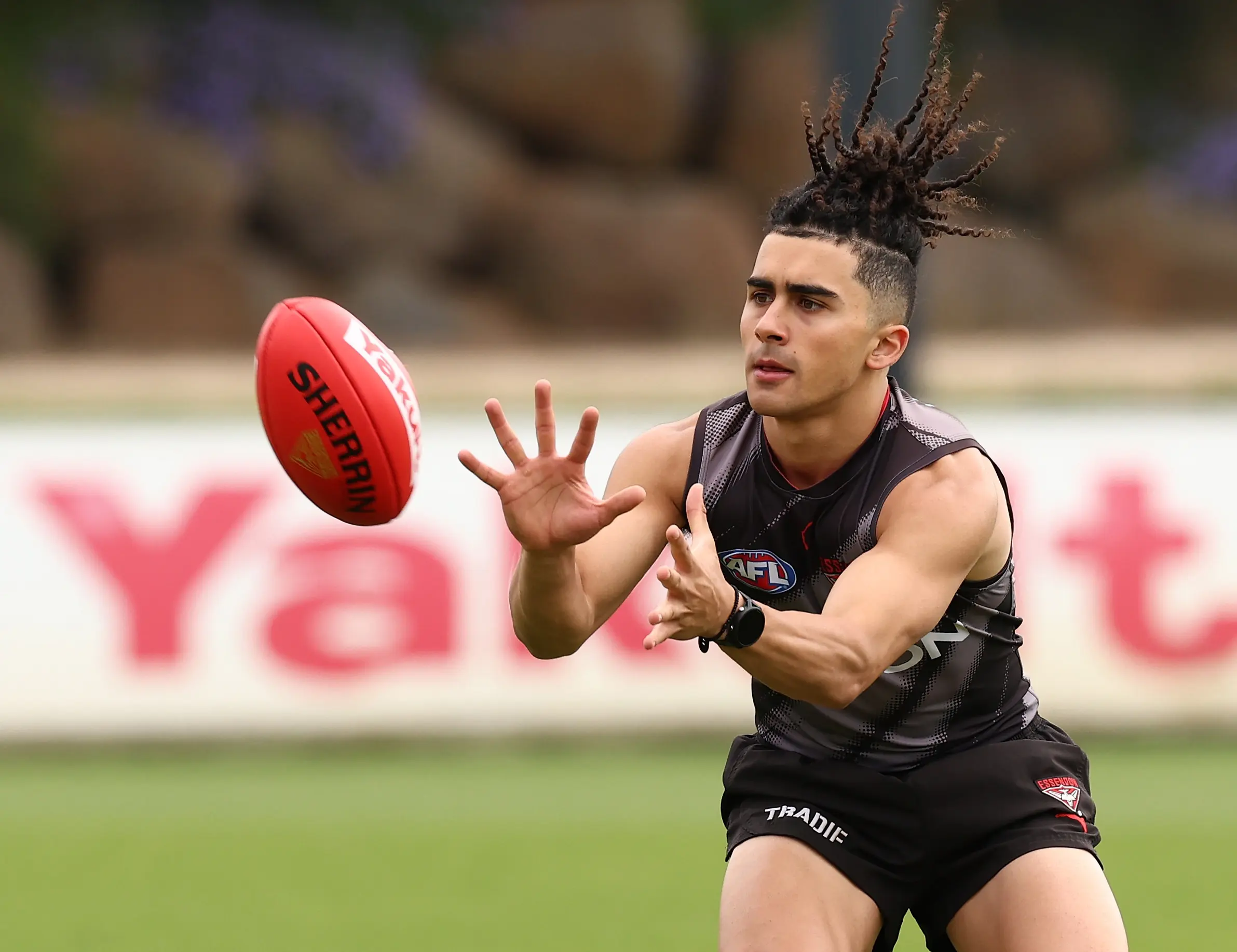 MELBOURNE, AUSTRALIA - NOVEMBER 10: Isaac Kako marks the ball during the Essendon Bombers Pre-Season Training Media Opportunity at NEC Hangar on November 10, 2025 in Melbourne, Australia. (Photo by James Wiltshire/AFL Photos via Getty Images)