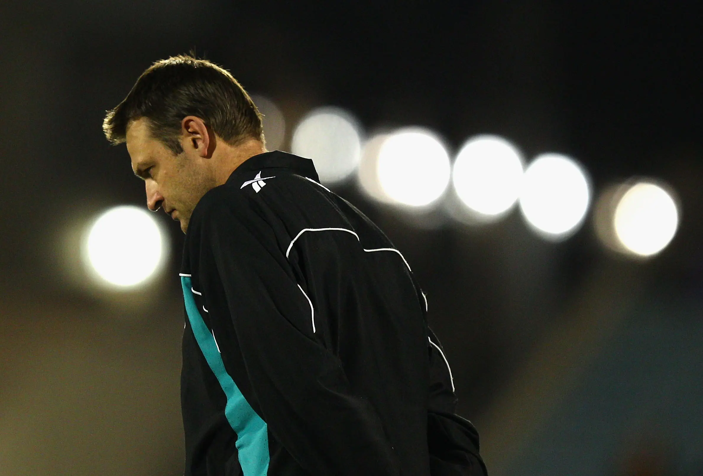 ADELAIDE, AUSTRALIA - JUNE 10: Matthew Primus, coach of the Power, loosk dejected after the round 11 AFL match between the Port Adelaide Power and the Hawthorn Hawks at AAMI Stadium on June 10, 2012 in Adelaide, Australia. (Photo by Ryan Pierse/Getty Images)