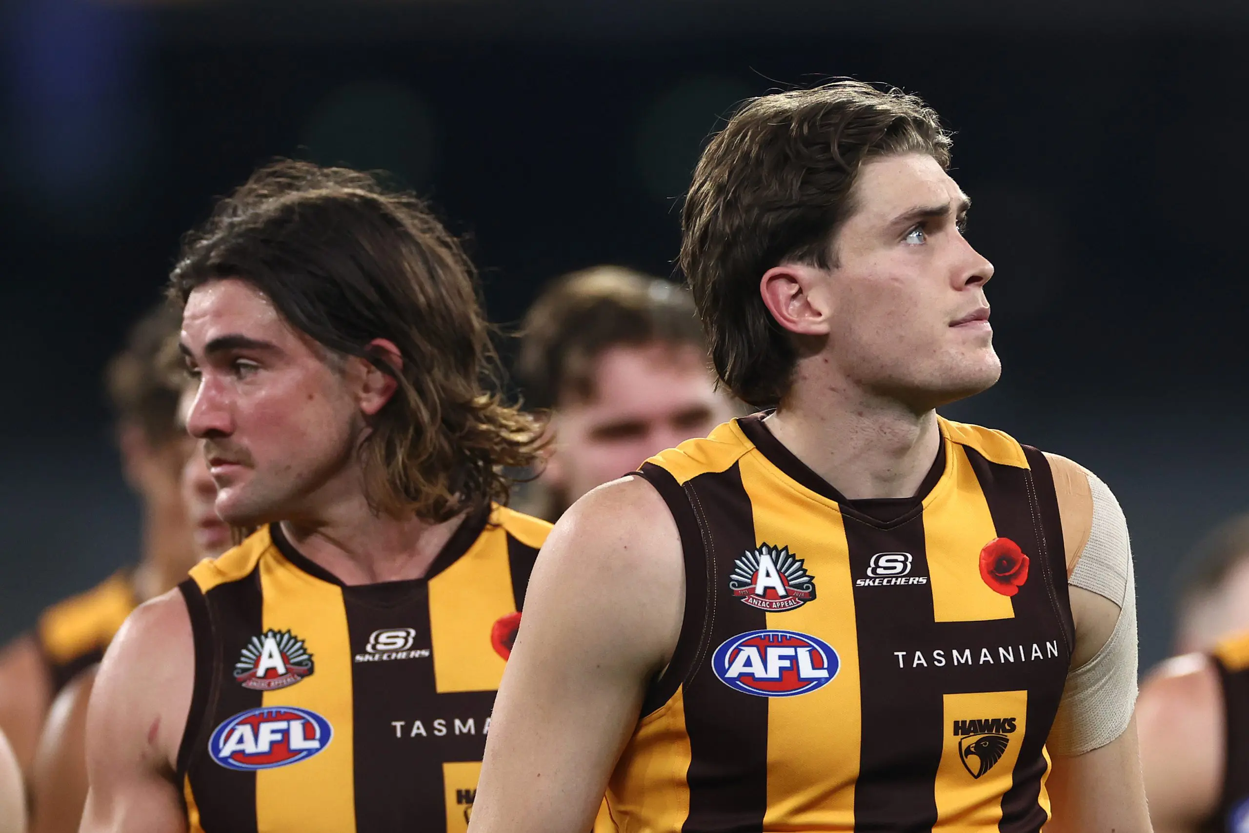 MELBOURNE, AUSTRALIA - APRIL 28: Will Day and his Hawks team mates look dejected after losing the round seven AFL match between Hawthorn Hawks and Sydney Swans at Melbourne Cricket Ground, on April 28, 2024, in Melbourne, Australia. (Photo by Quinn Rooney/Getty Images)