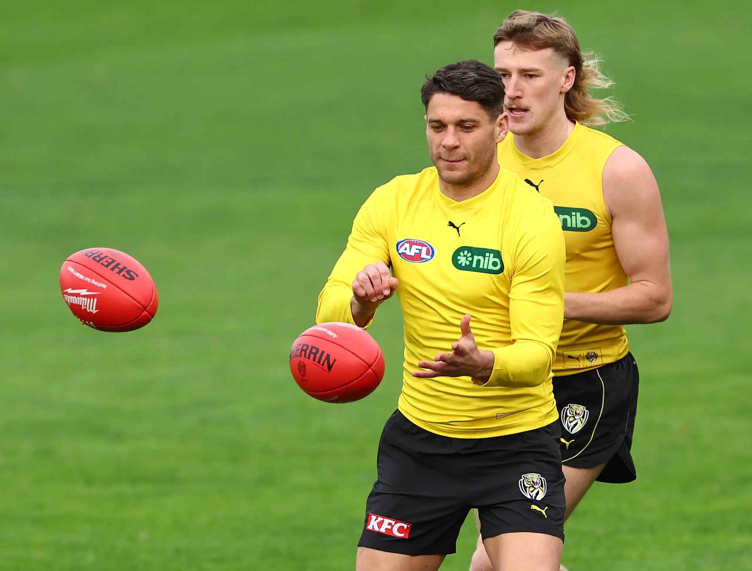 MELBOURNE, AUSTRALIA - JUNE 04: Dion Prestia of the Tigers handballs during a Richmond Tigers AFL training session at Punt Road Oval on June 04, 2024 in Melbourne, Australia. (Photo by Quinn Rooney/Getty Images)