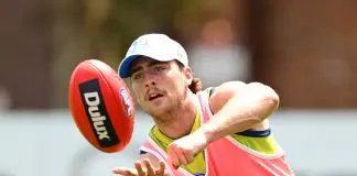 North Melbourne gun’s extent of injury revealed, veteran downed MELBOURNE, AUSTRALIA - DECEMBER 09: George Wardlaw of the Kangaroos handballs during a North Melbourne Kangaroos AFL training session at Arden Street Ground on December 09, 2024 in Melbourne, Australia. (Photo by Quinn Rooney/Getty Images)