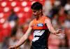 SYDNEY, AUSTRALIA - MARCH 09: Sam Taylor of the Giants kicks on the run during the 2025 AFL Opening Round match between the GWS Giants and the Collingwood Magpies at ENGIE Stadium on March 9, 2025 in Sydney, Australia. (Photo by Dylan Burns/AFL Photos via Getty Images)