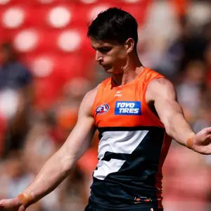 SYDNEY, AUSTRALIA - MARCH 09: Sam Taylor of the Giants kicks on the run during the 2025 AFL Opening Round match between the GWS Giants and the Collingwood Magpies at ENGIE Stadium on March 9, 2025 in Sydney, Australia. (Photo by Dylan Burns/AFL Photos via Getty Images)