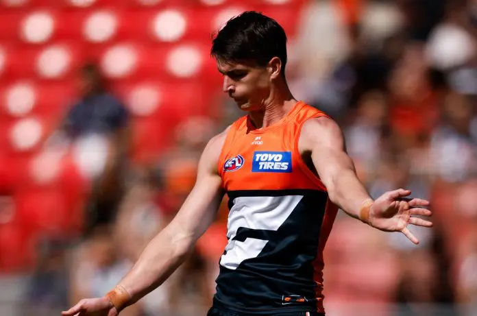 SYDNEY, AUSTRALIA - MARCH 09: Sam Taylor of the Giants kicks on the run during the 2025 AFL Opening Round match between the GWS Giants and the Collingwood Magpies at ENGIE Stadium on March 9, 2025 in Sydney, Australia. (Photo by Dylan Burns/AFL Photos via Getty Images)