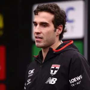 MELBOURNE, AUSTRALIA - JULY 13: Max King  presents Max Heath of the Saints with his debut guernsey ahead of the round 18 AFL match between St Kilda Saints and Sydney Swans at Marvel Stadium on July 13, 2025 in Melbourne, Australia. (Photo by Morgan Hancock/Getty Images)