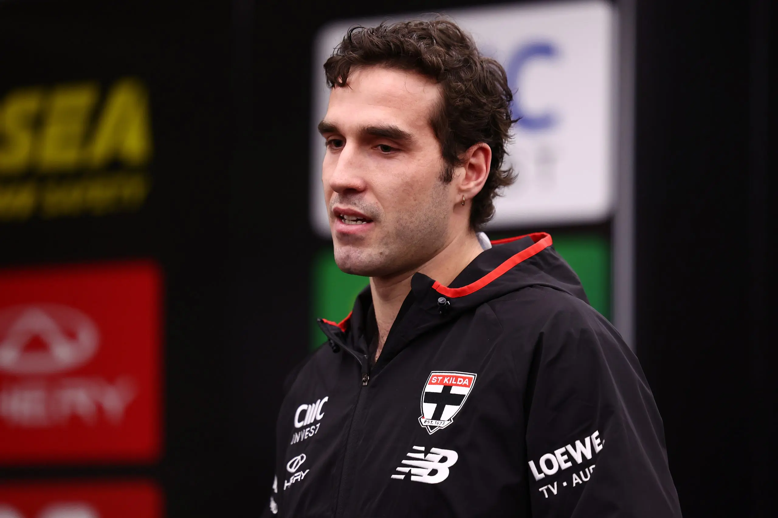 MELBOURNE, AUSTRALIA - JULY 13: Max King presents Max Heath of the Saints with his debut guernsey ahead of the round 18 AFL match between St Kilda Saints and Sydney Swans at Marvel Stadium on July 13, 2025 in Melbourne, Australia. (Photo by Morgan Hancock/Getty Images)