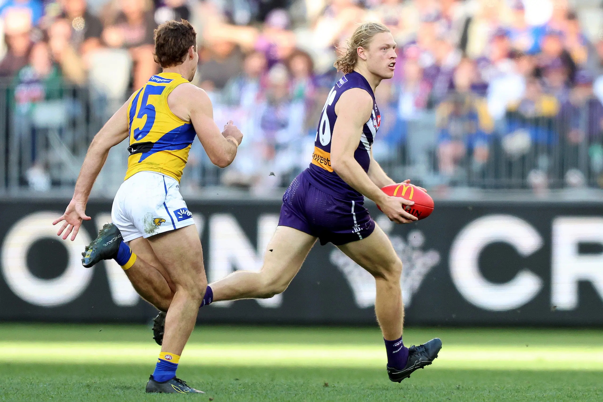 PERTH, AUSTRALIA - JULY 26: Hayden Young of the Dockers in action during the round 20 AFL match between Fremantle Dockers and West Coast Eagles at Optus Stadium on July 26, 2025 in Perth, Australia. (Photo by Janelle St Pierre/AFL Photos/Getty Images)