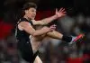 MELBOURNE, AUSTRALIA - AUGUST 16: Sam Walsh of the Blues kicks the ball during the round 23 AFL match between Carlton Blues and Port Adelaide Power at Marvel Stadium on August 16, 2025 in Melbourne, Australia. (Photo by Morgan Hancock/Getty Images)