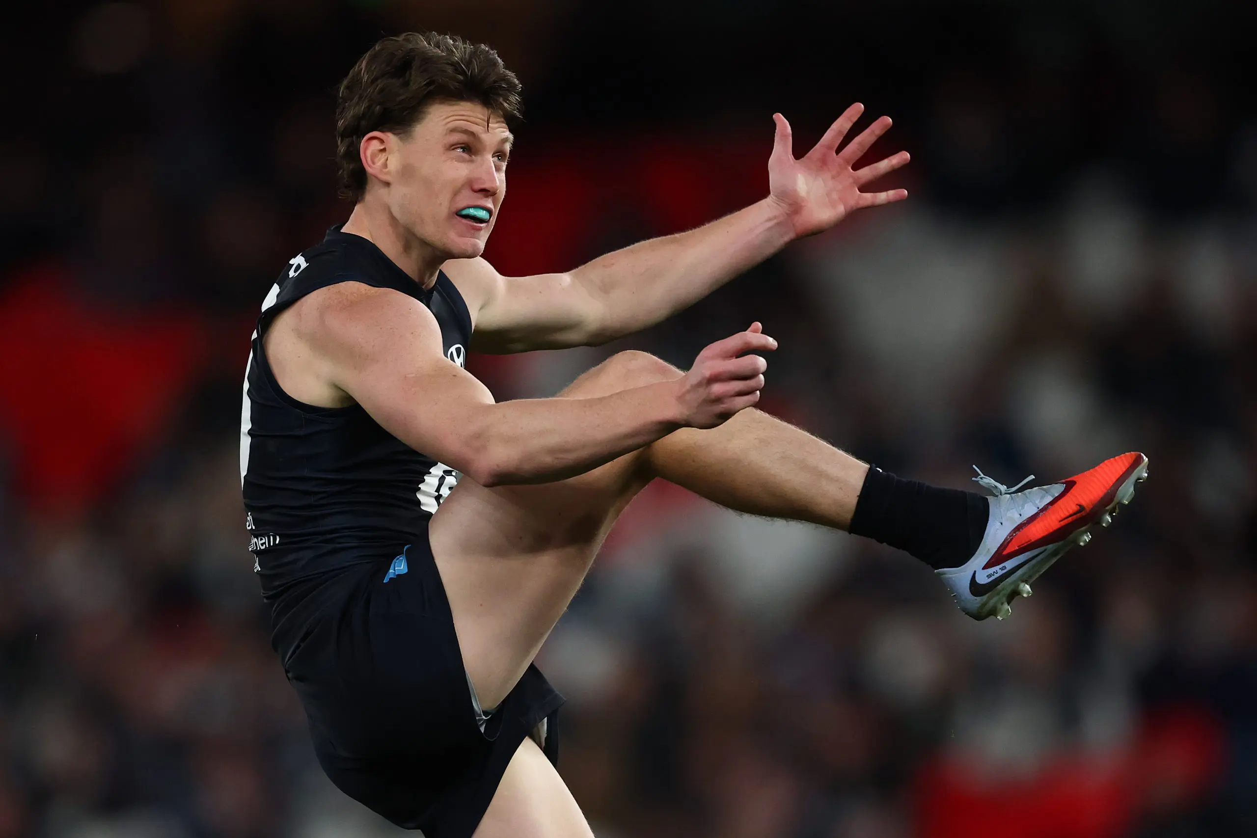MELBOURNE, AUSTRALIA - AUGUST 16: Sam Walsh of the Blues kicks the ball during the round 23 AFL match between Carlton Blues and Port Adelaide Power at Marvel Stadium on August 16, 2025 in Melbourne, Australia. (Photo by Morgan Hancock/Getty Images)