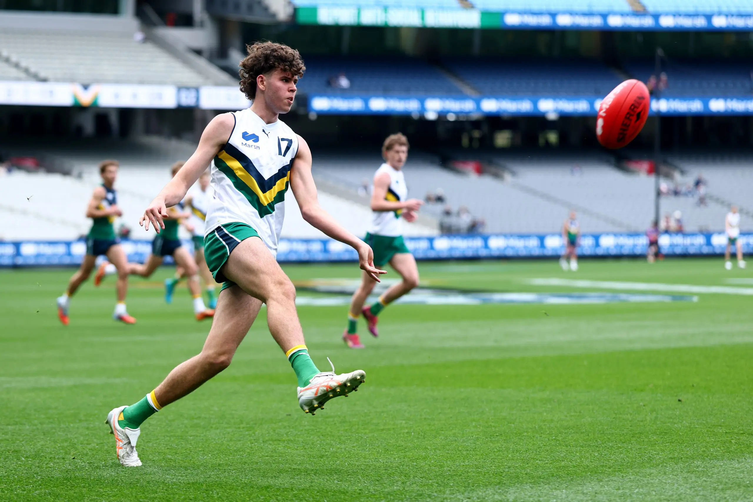 MELBOURNE, AUSTRALIA - SEPTEMBER 27: Dougie Cochrane of Team Boak kicks during the Marsh AFL National Futures Boys match between Team Boak and Team Docherty at Melbourne Cricket Ground, on September 27, 2025 in Melbourne, Australia. (Photo by Josh Chadwick/AFL Photos/via Getty Images)