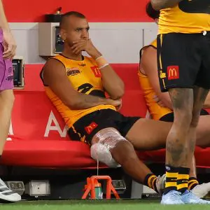 PERTH, AUSTRALIA - FEBRUARY 14: Callum Ah Chee of Western Australia looks on from the bench with ice on his hamstring during the 2026 AFL Origin match between Western Australia and Victoria at Optus Stadium on February 14, 2026 in Perth, Australia. (Photo by Michael Willson/AFL Photos via Getty Images)
