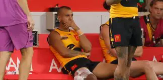 PERTH, AUSTRALIA - FEBRUARY 14: Callum Ah Chee of Western Australia looks on from the bench with ice on his hamstring during the 2026 AFL Origin match between Western Australia and Victoria at Optus Stadium on February 14, 2026 in Perth, Australia. (Photo by Michael Willson/AFL Photos via Getty Images)