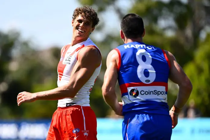MELBOURNE, AUSTRALIA - FEBRUARY 19: Charlie Curnow of the Swans chats to former Carlton teammate Matthew Kennedy of the Bulldogs during the 2026 AFL match simulation between the Western Bulldogs and the Sydney Swans at Mission Whitten Oval on February 19, 2026 in Melbourne, Australia. (Photo by Adam Trafford/AFL Photos via Getty Images)