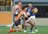 SYDNEY, AUSTRALIA - AUGUST 18: Toby Greene of the Giants tackles Marcus Bontempelli of the Bulldogs during the round 22 AFL match between the Greater Western Sydney Giants and the Western Bulldogs at GIANTS Stadium on August 18, 2019 in Sydney, Australia. (Photo by Mark Metcalfe/Getty Images)