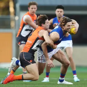 SYDNEY, AUSTRALIA - AUGUST 18: Toby Greene of the Giants tackles Marcus Bontempelli of the Bulldogs during the round 22 AFL match between the Greater Western Sydney Giants and the Western Bulldogs at GIANTS Stadium on August 18, 2019 in Sydney, Australia. (Photo by Mark Metcalfe/Getty Images)