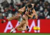 MELBOURNE, AUSTRALIA - JUNE 21: Marcus Windhager of the Saints tackles Nick Daicos of the Magpies during the round 15 AFL match between Collingwood Magpies and St Kilda Saints at Marvel Stadium, on June 21, 2025, in Melbourne, Australia. (Photo by Quinn Rooney/Getty Images)