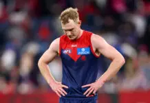 MELBOURNE, AUSTRALIA - AUGUST 10: Harrison Petty of the Demons looks dejected after losing the round 22 AFL match between Melbourne Demons and Western Bulldogs at Melbourne Cricket Ground on August 10, 2025 in Melbourne, Australia. (Photo by Josh Chadwick/AFL Photos/via Getty Images)