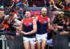 MELBOURNE, AUSTRALIA - AUGUST 16: Steven May and Max Gawn lead the Demons players out before  the round 23 AFL match between Hawthorn Hawks and Melbourne Demons at Melbourne Cricket Ground on August 16, 2025 in Melbourne, Australia. (Photo by Josh Chadwick/Getty Images)