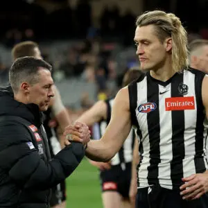 MELBOURNE, AUSTRALIA - SEPTEMBER 20: Craig McRae, Senior Coach of the Magpies and Darcy Moore of the Magpies look dejected after losing the AFL Preliminary Final match between Collingwood Magpies and Brisbane Lions at Melbourne Cricket Ground on September 20, 2025 in Melbourne, Australia. (Photo by Robert Cianflone/Getty Images)