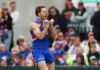 MELBOURNE, AUSTRALIA - SEPTEMBER 21: Will Lewis of the Bulldogs celebrates kicking a goal during the 2025 VFL Grand Final match between Footscray Bulldogs and Southport Sharks at Ikon Park on September 21, 2025 in Melbourne, Australia. (Photo by Daniel Pockett/Getty Images)