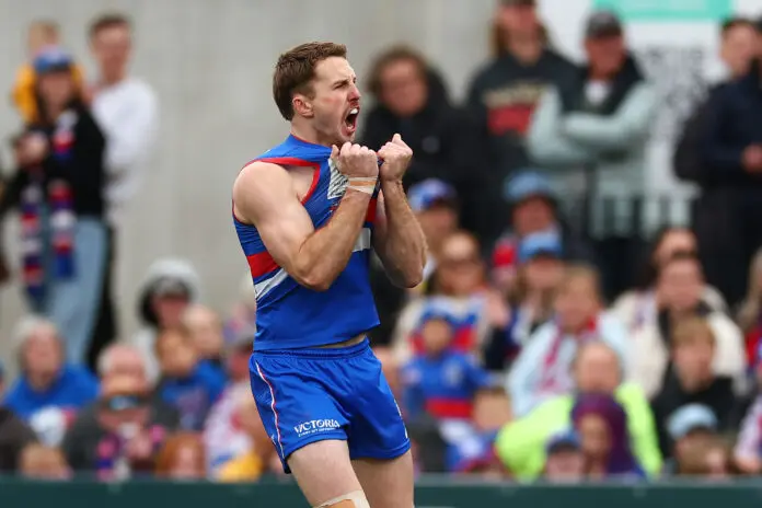 MELBOURNE, AUSTRALIA - SEPTEMBER 21: Will Lewis of the Bulldogs celebrates kicking a goal during the 2025 VFL Grand Final match between Footscray Bulldogs and Southport Sharks at Ikon Park on September 21, 2025 in Melbourne, Australia. (Photo by Daniel Pockett/Getty Images)
